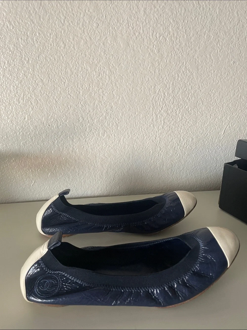 CHANEL Navy and Ivory Quilted Cap-Toe Ballet Flats